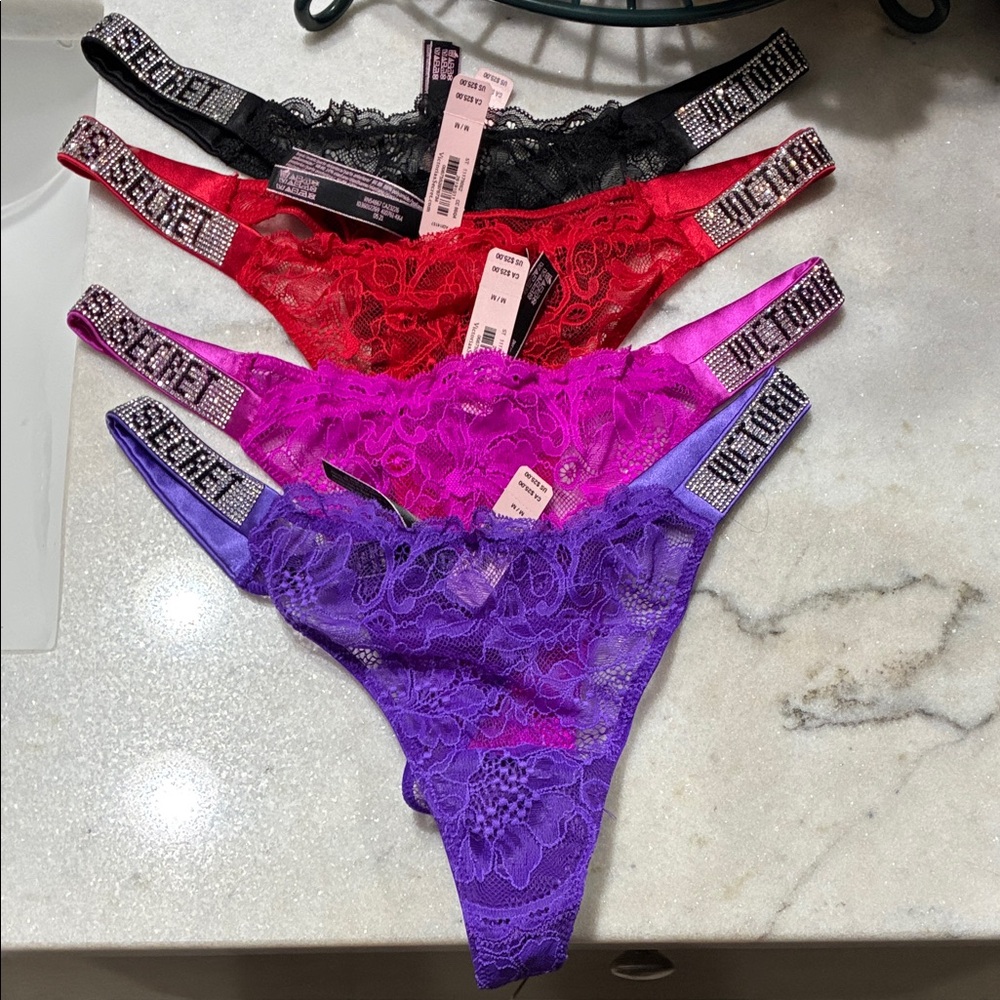 4 Victorias Secret lace thongs
